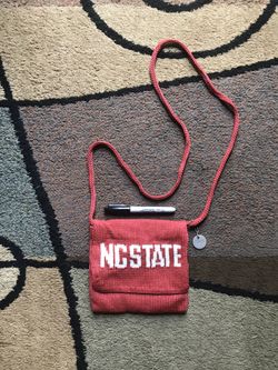 NC State University The Sak Crossbody This is brand new without tags. It is a flap Crossbody Bag, but also zips closed to secure your items. There i