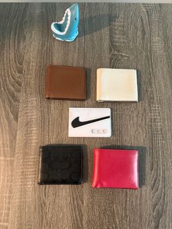 Coach and Nike men’s wallets.