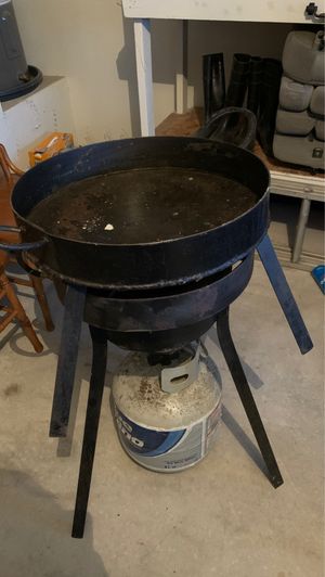 Photo Propane stove cooking setup with propane tank