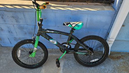 Boys green bike