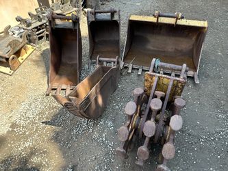 Caterpillar Backhoe Buckets And Compaction Wheel