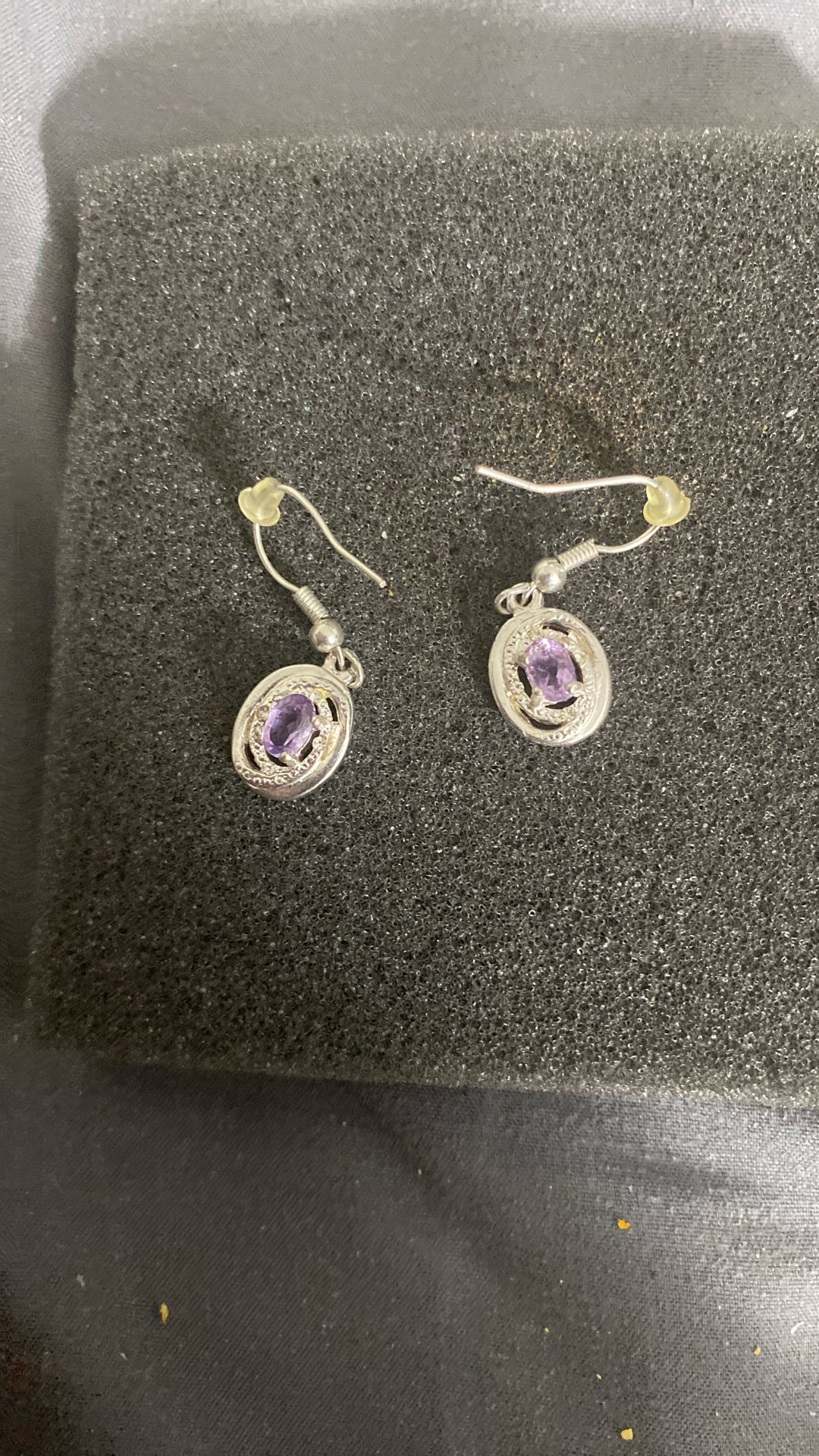They are amethyst and sterling silver dangle earrings.