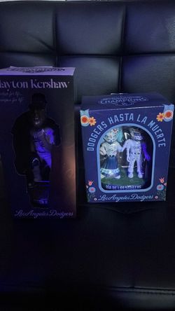 Dodger bobble heads of “Clayton Kershaw” and “dia de los dodgers”