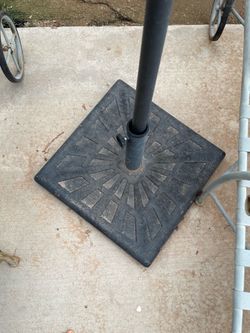 Two umbrella stands + one umbrella