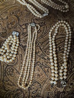 Pearl necklaces and bracelet earrings