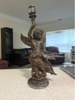 antique bronze cherub holding a torch candle holder 14in