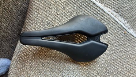 New racing bike saddle made of magnesium light and perfect cut out sectional for speed comfort