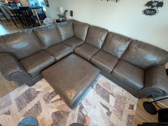 Ashley Signature leather sectional with ottoman