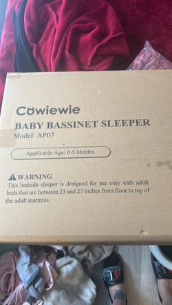 Pink cowiewie baby bassinet