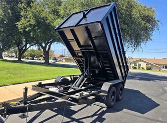 Scissor lift dump trailer