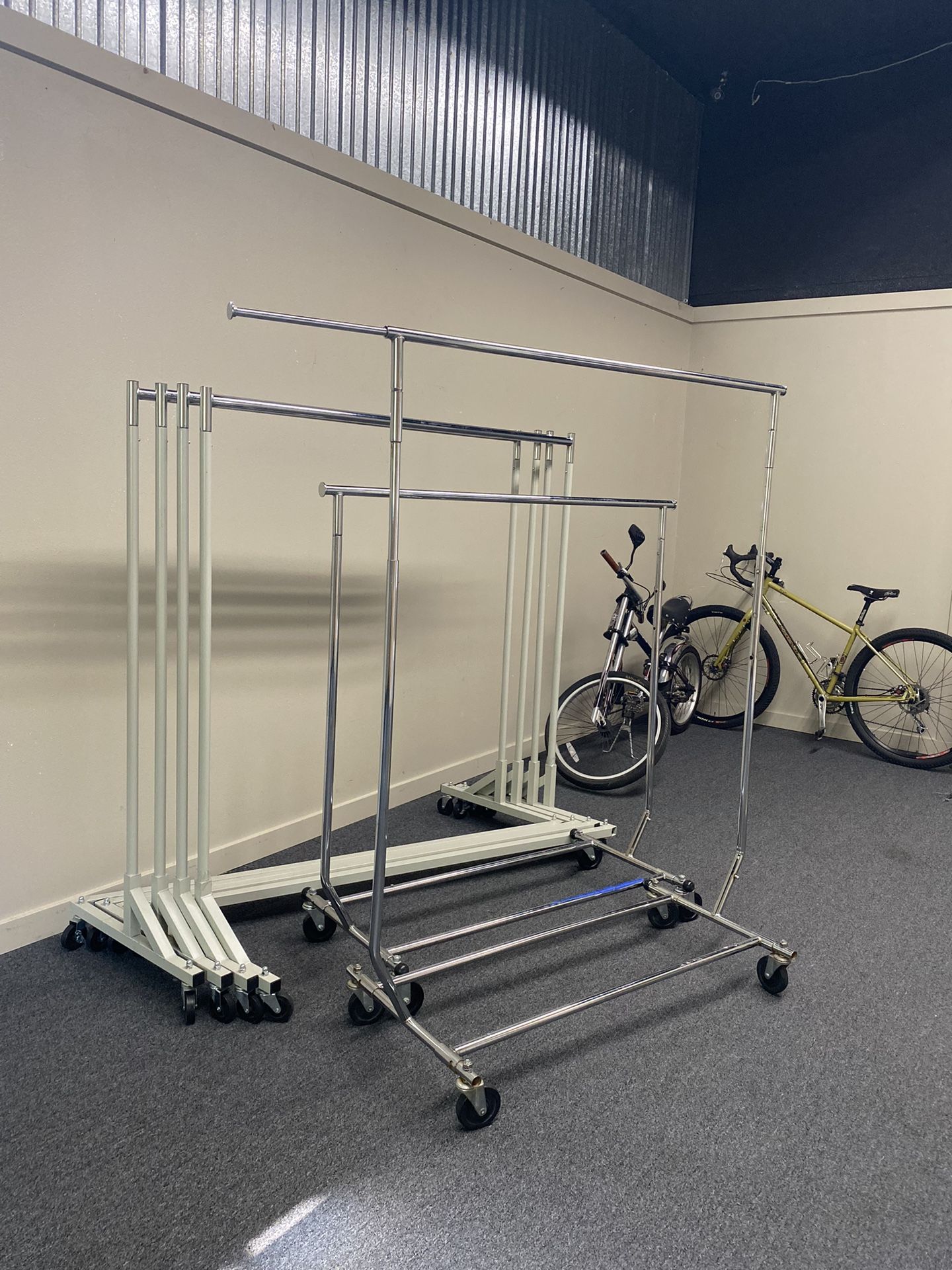 Two āZā base clothing racks available