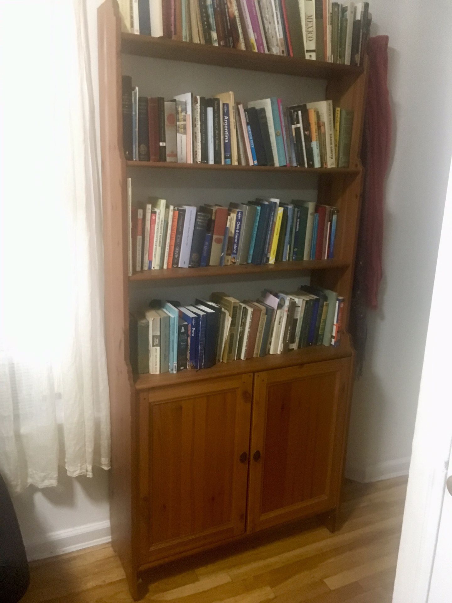 Tall pine bookcase with cabinet