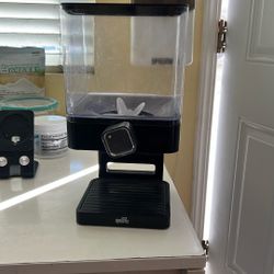 Grain dispensing containers