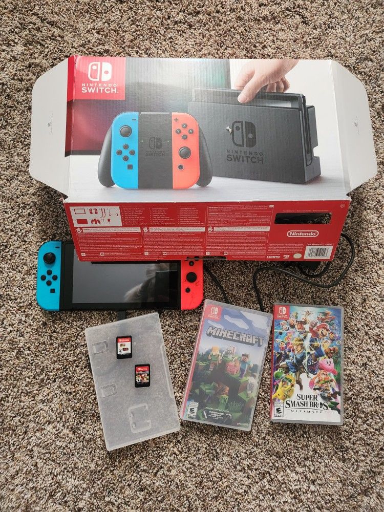 Nintendo switch 32 GB with 4 games and Accessories, Neon Red and Blue