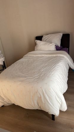 Twin Bed with Dark Upholstered Frame