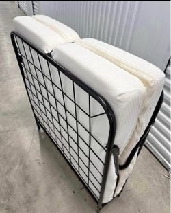 Twin folding bed like new used only once .
