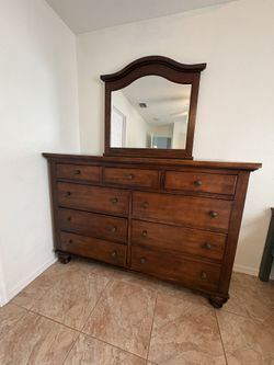 Wooden Dresser With Attached Mirror