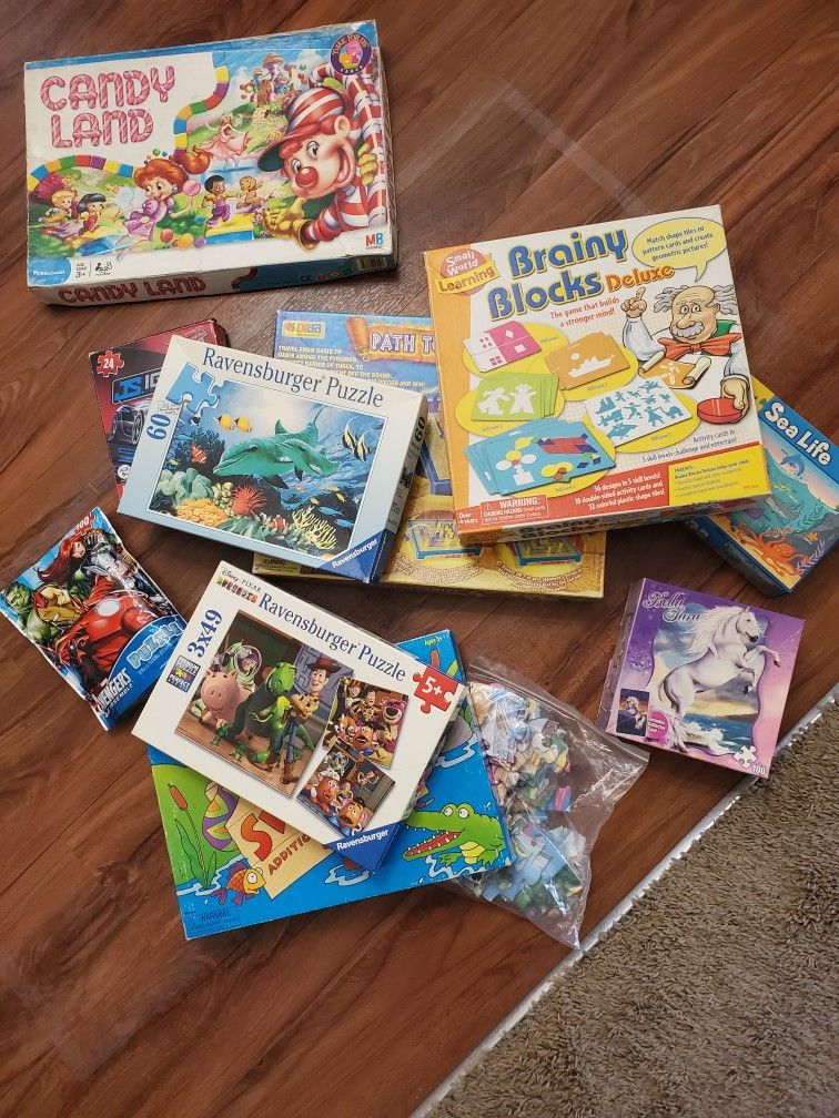 Assorted Board Games And Jigsaw Puzzles