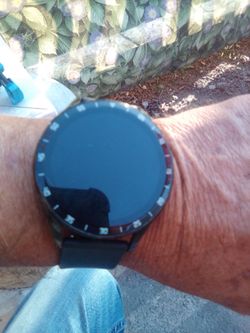 Smartwatch with wireless air buds inside watch