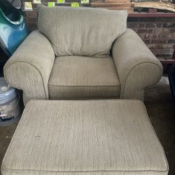 Oversized chair with rolling ottoman 