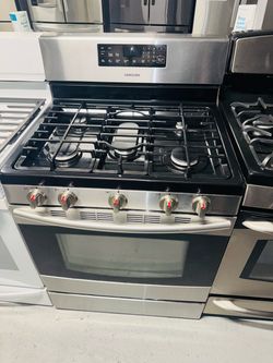 Samsung stainless steel natural gas stove; includes a receipt for a 60-day warranty.