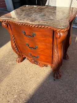 Ornate Ashley Furniture Marble-Top 3-drawer nightstand