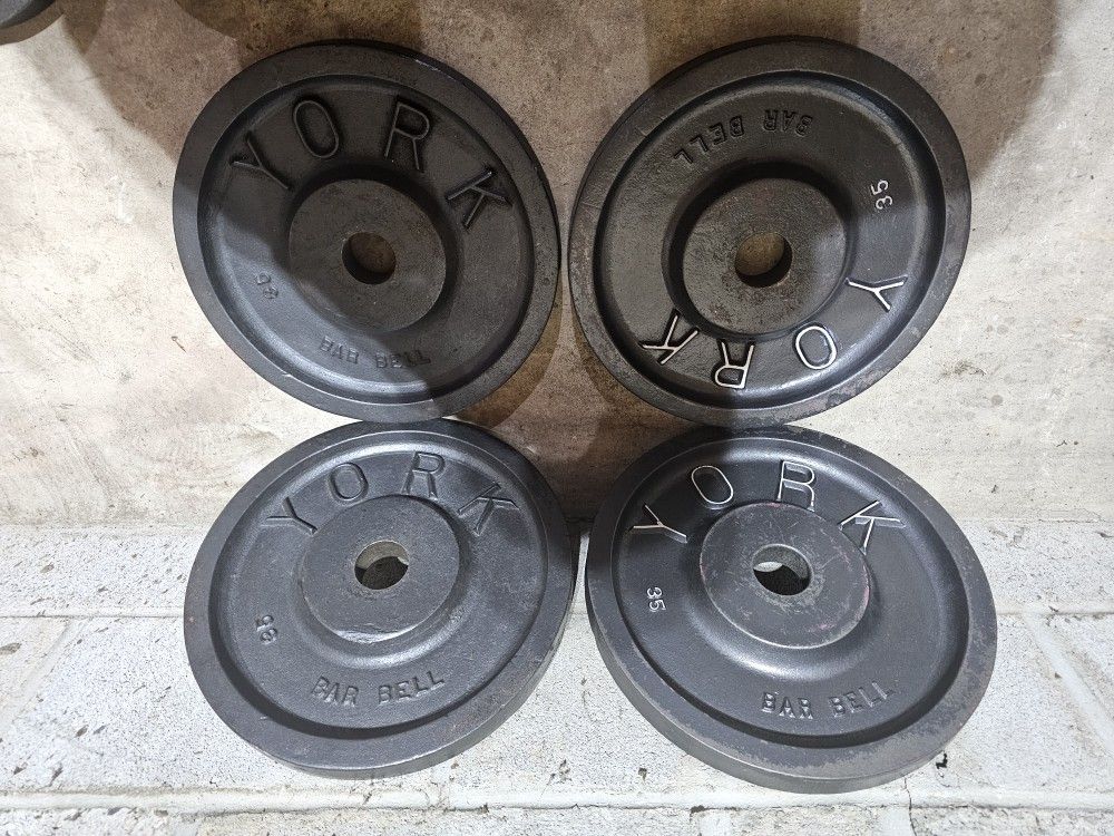 Milled vintage York 140lbs Olympic 2" weights