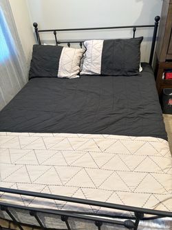 Queen size bed with mattress and bedding no pillows in Azusa