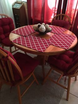 Table, chairs, cushions, and place mats