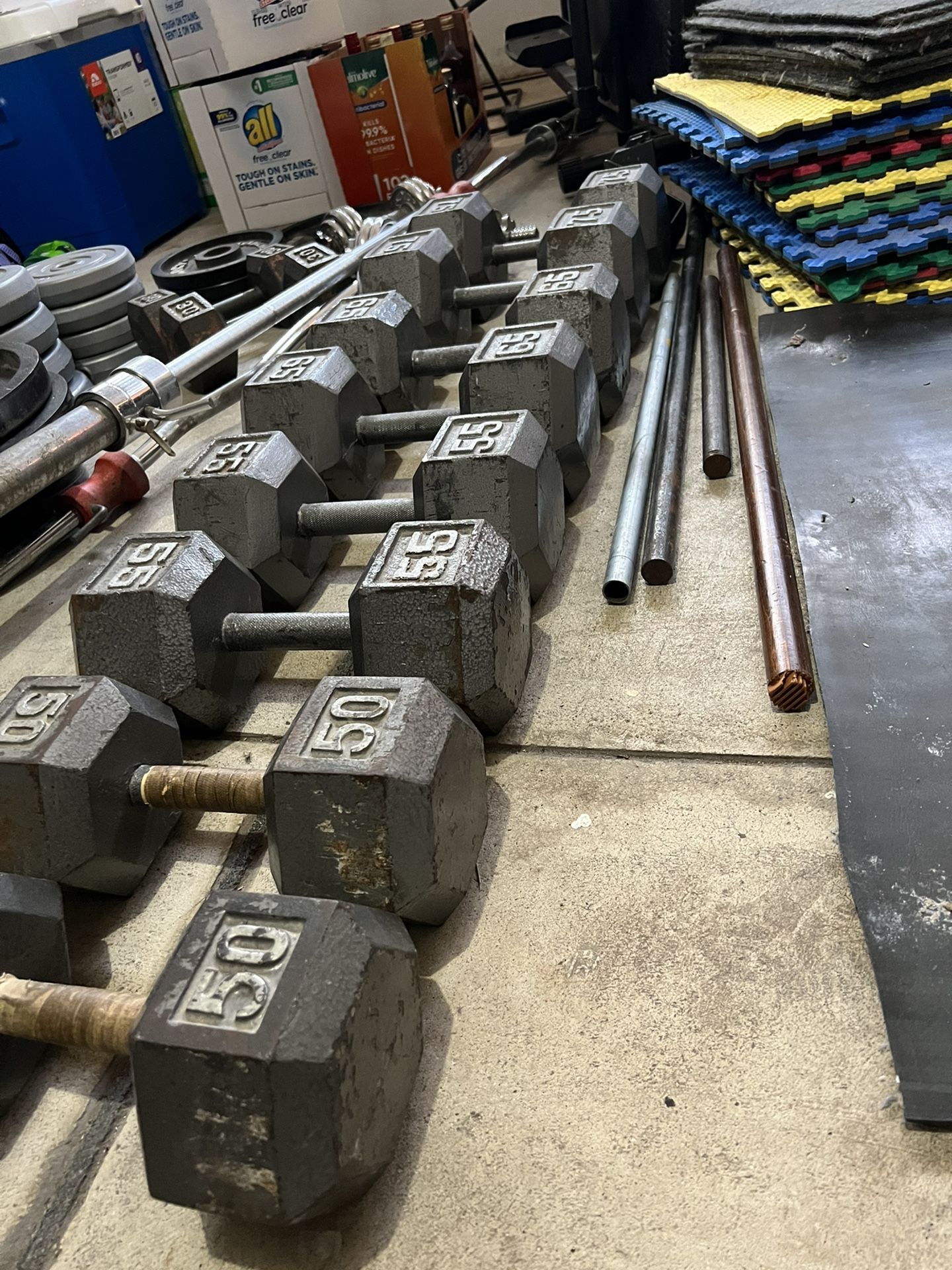 Four Sets Of Dumbbells 50, 55,65,75 Lb