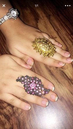 Brand new big rings size 8 pink one is $20 and golden one is $10