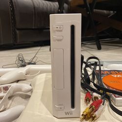 Wii with all the fixings every thing works, comes with 1 controller and 5 games