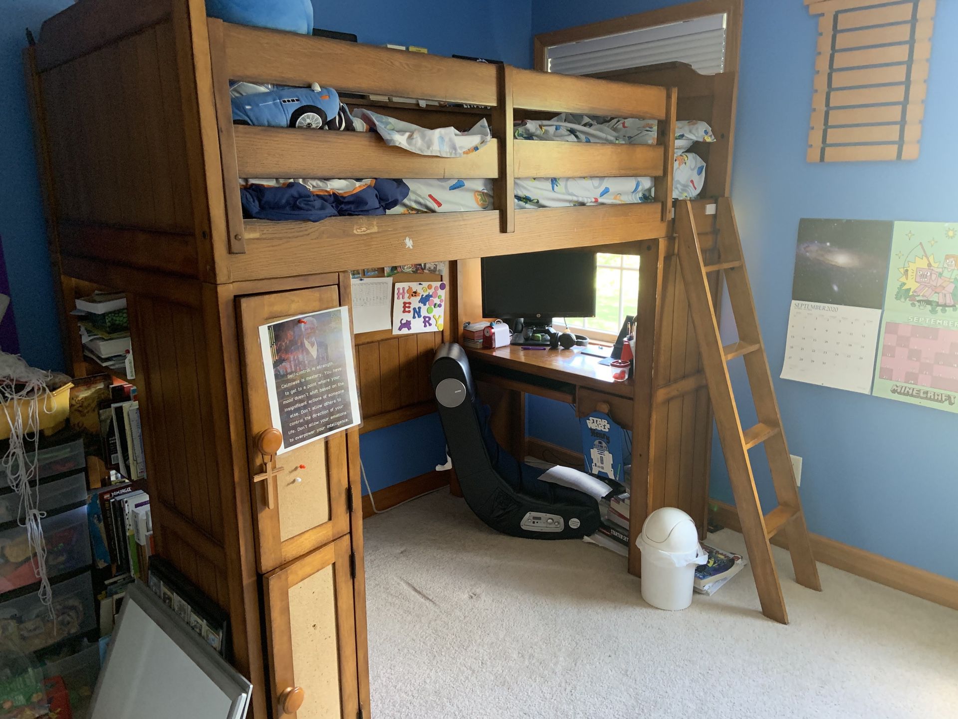 Lifted twin bed with built in desk