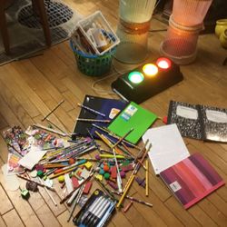 Many Items  For School, A Lot Of Pencils , Erasers , Note Books, A Red, Yellow , And Green  Light For The Teacher