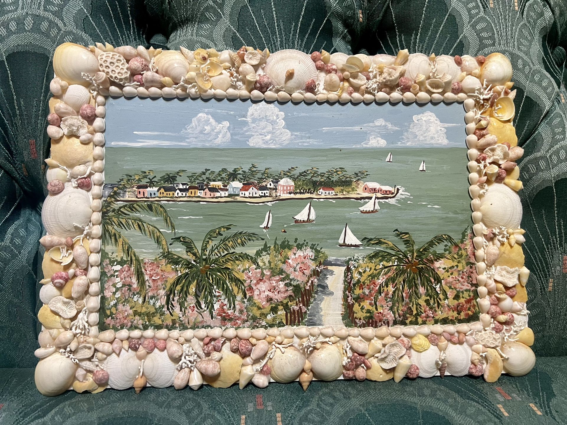 Vintage tropical beach painting with a seashell frame