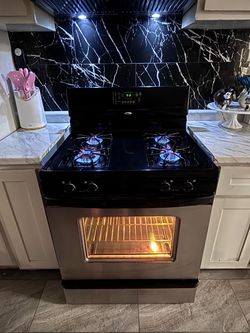 Black Whirlpool stove with stainless steel