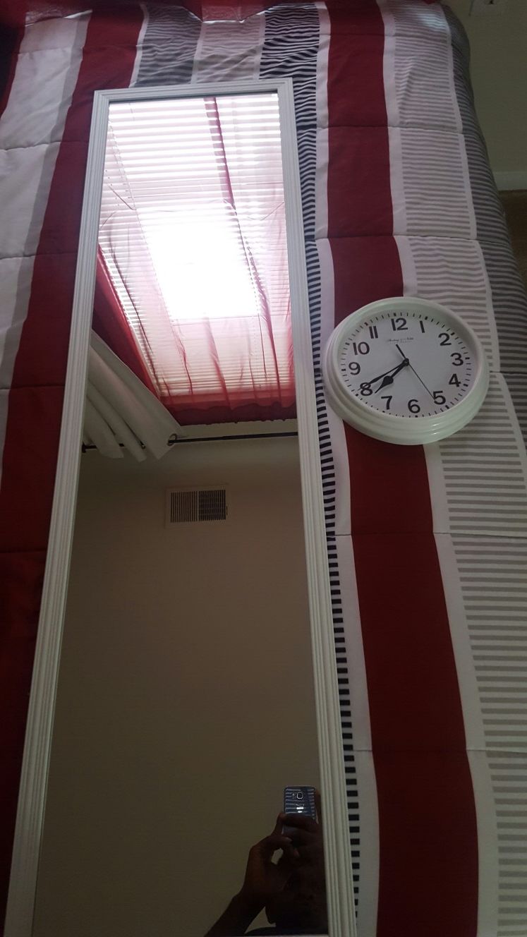 White mirror and wall clock