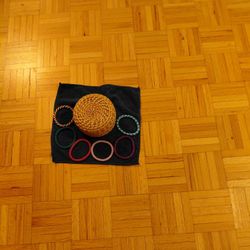 Woven Container With Lid And Several Crocheted Beaded Bracelets