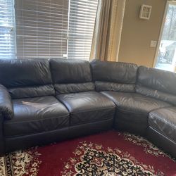 Raymour and Flanigan Cindy Crawford Black Leather Sectional Right Arm Facing Sofa Used In A Non Smoking And Pet Free Home