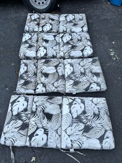 Outdoor chair cushions, needs a cleaning , fair condition has a few small rips but still very useable $15 for all 4