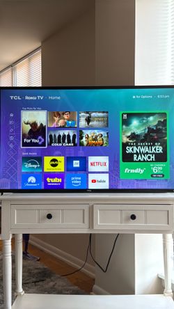 Roku TV and white night stand