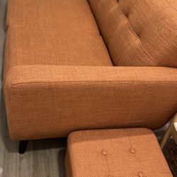 Orange couch with ottoman