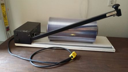 24" shrink wrap station with a roll of film