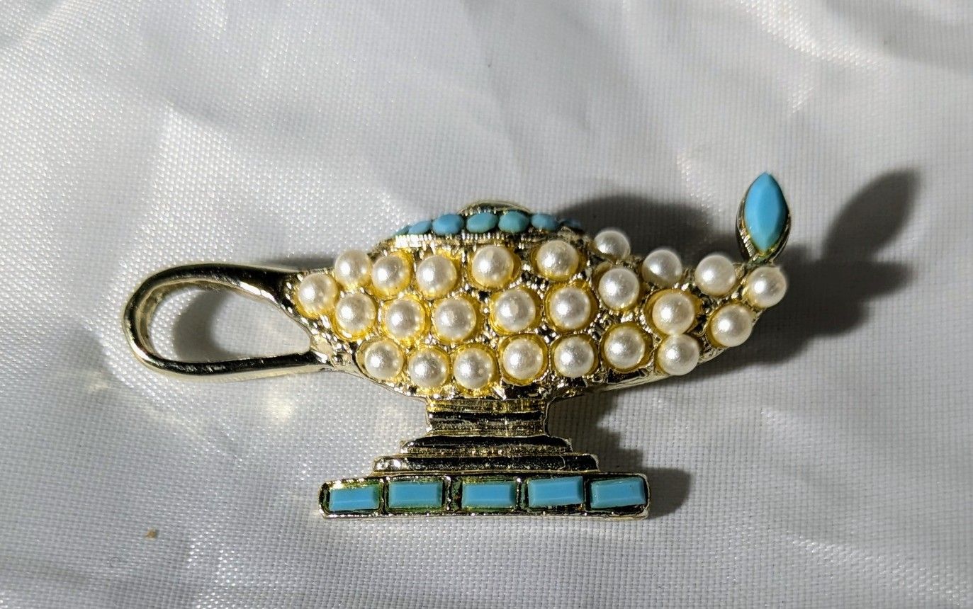This Magical Vintage Pearl Like Lamp Brooch simply glows brilliantly with rich turquoise glass enhancements.  It is a rare, unique find!