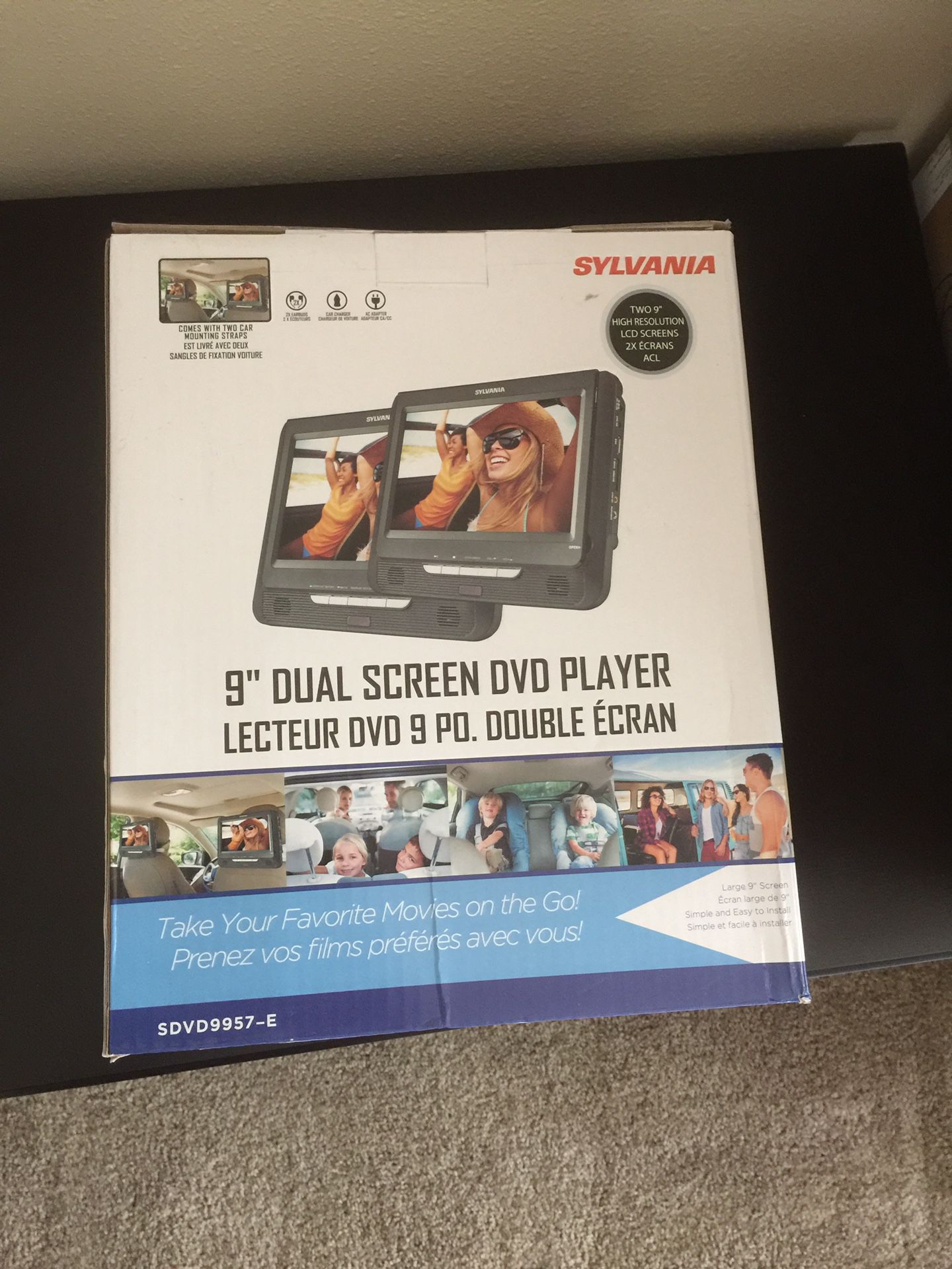New in box 9” dual screen DVD player