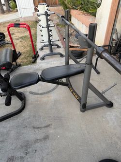 Very strong Olympic weight bench with 7 ft Olympic bar