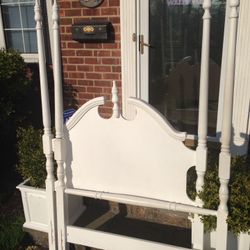 White twin poster bed