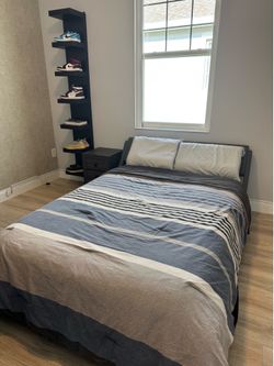 Full size bed with mattress, nightstand and floating shelves