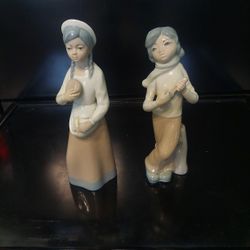 GIRL HOLDING BREAD, BOY PLAYING STRING INSTRUMENT