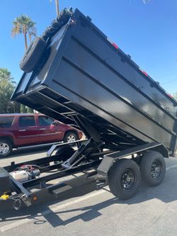 Scissor lift dump trailer